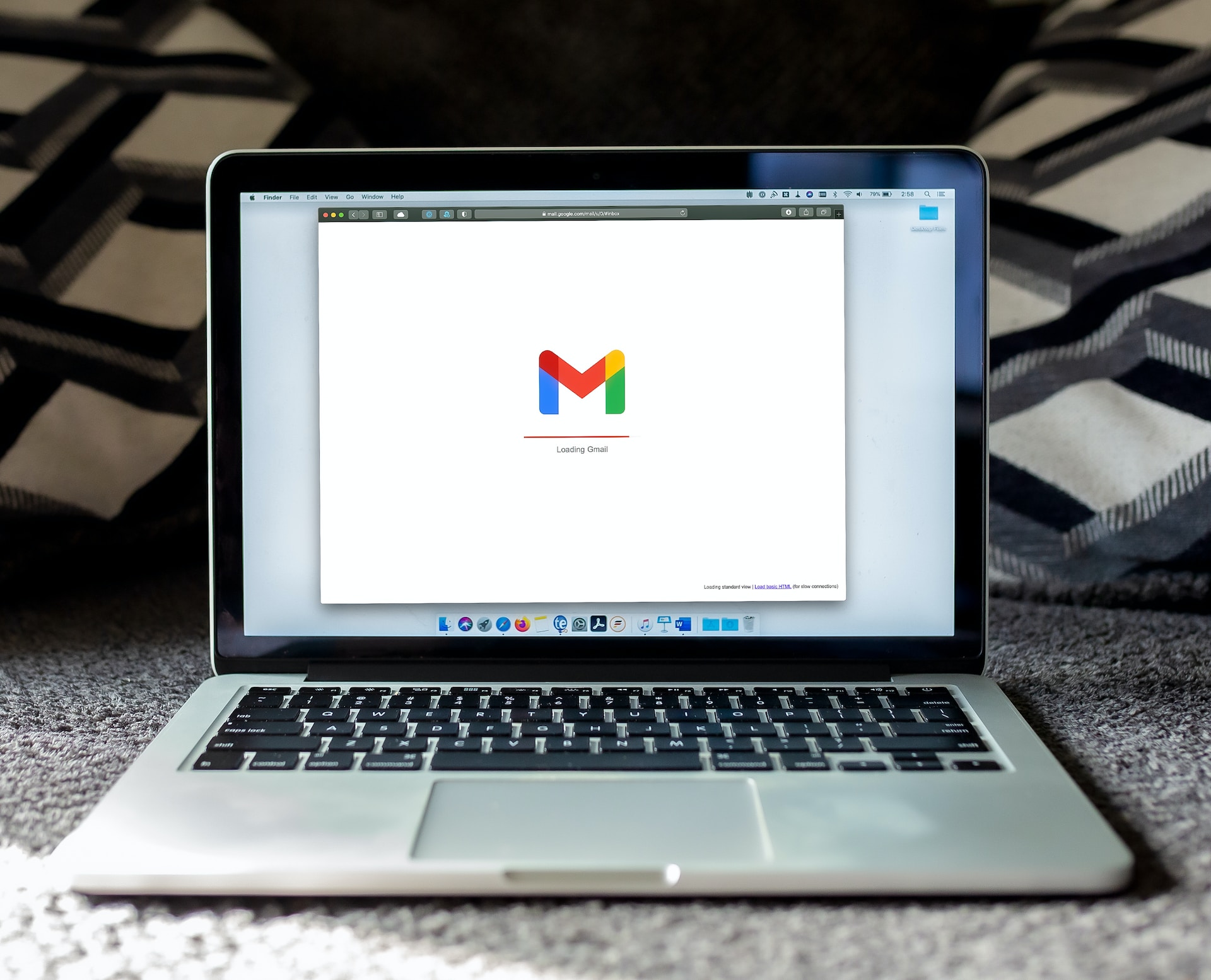 A Macbook on which Gmail is accessed